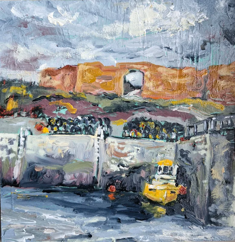 Red sandstone ruins of the battery with an arched opening, above a harbour wall with lobster creels and a yellow boat, under a stormy sky